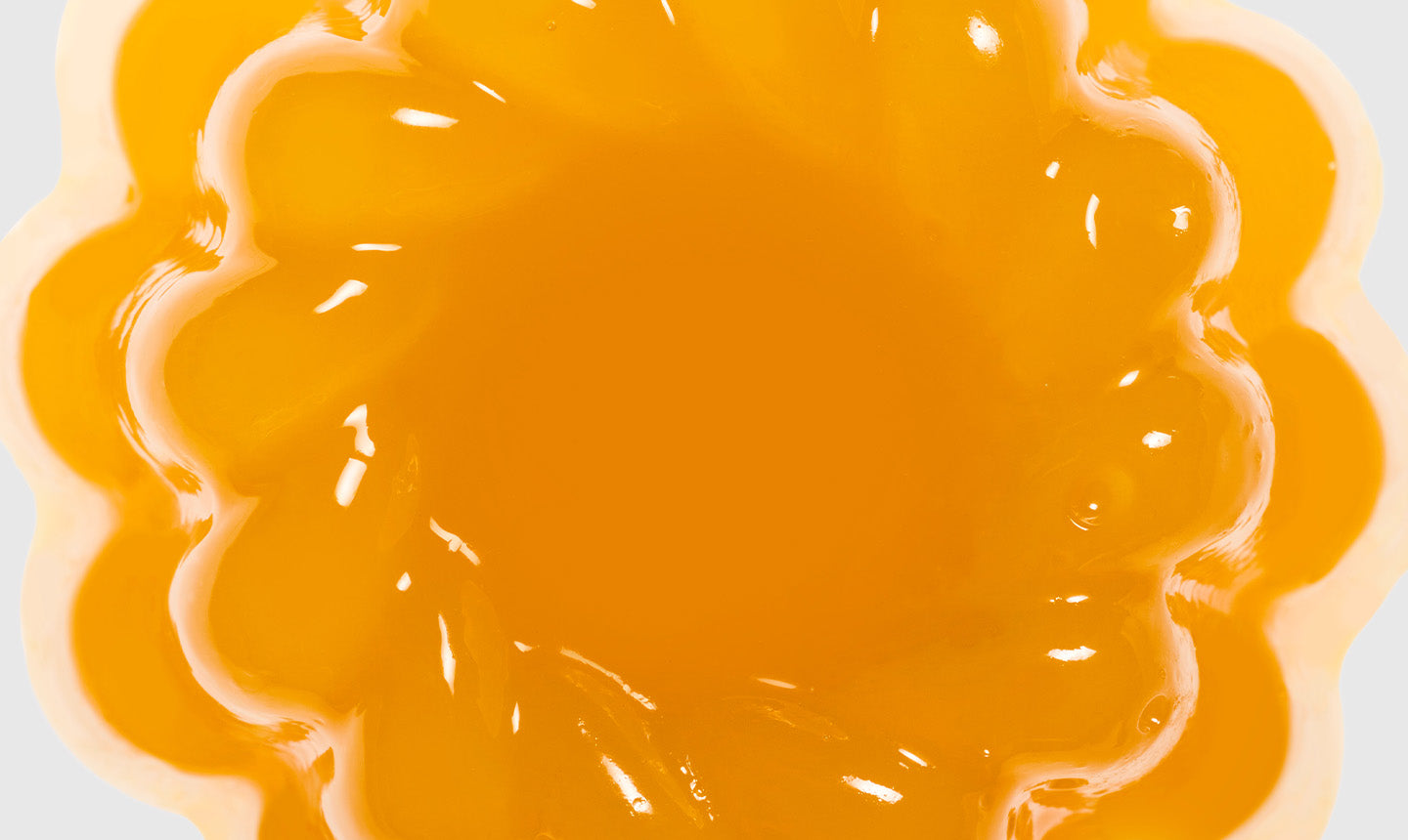 Close up of glistening Passion Geleé in bundt form