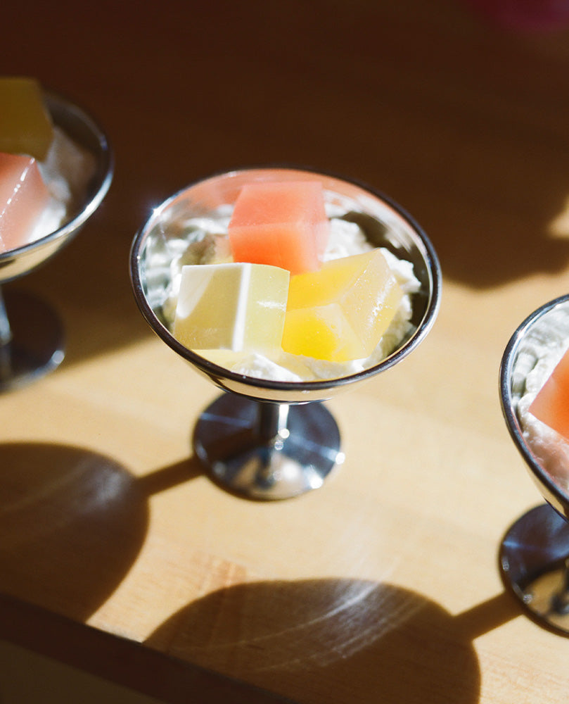 Row of Gelée dessert cups with colorful cubes of jelly